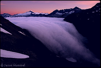 Fog pouring over Cascade Pass. © Jason Hummel