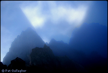 Sunlight and fog over Ragged Ridge. Photo © Pat Gallagher