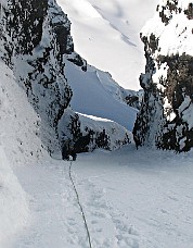 Daniel Jeffrey climbs the final gully to the summit snowfield. Photo © Tom Sjolseth.