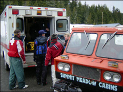 Rescuers gather next to an ambulance on Mount Hood. Photo © Matthew Weaver.