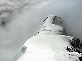 Jason Hummel climbs to the summit ridge of Columbia Peak. Photo © Ryan Lurie.